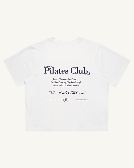 White t-shirt with 'Pilates Club' text on a white background