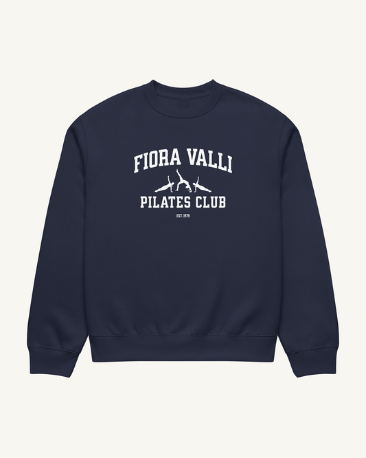 Navy blue sweatshirt with 'Fiora Valli Pilates Club' text on a beige background